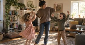 Mom and two children dancing and singing along to a free song in a sunny living room